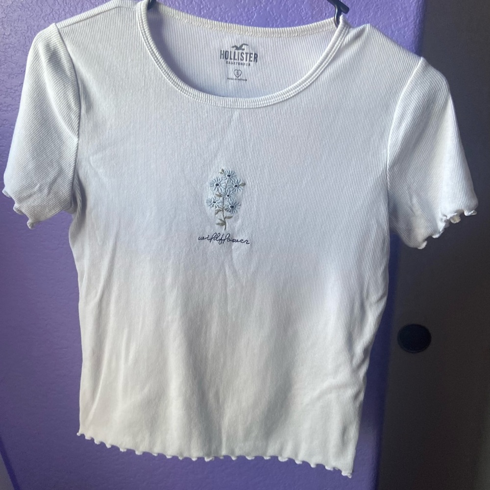 Hollister White top with embroidered blue flowers